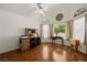 Bright home office with vaulted ceilings, hardwood flooring, and a large window at 1470 St Joseph St, Overton, NV 89040