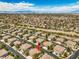 An elevated view highlights a neighborhood with consistent architecture, established trees, and accessible roadways at 1605 Colloquium Dr, Henderson, NV 89014
