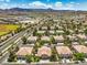 Community aerial showcases well-maintained homes with desert landscaping and nearby recreation at 1605 Colloquium Dr, Henderson, NV 89014