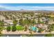 Community aerial view showcases a pool, mature trees, and well-maintained homes at 1605 Colloquium Dr, Henderson, NV 89014