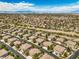 Scenic community aerial view with neat rows of houses and desert landscaping at 1605 Colloquium Dr, Henderson, NV 89014