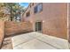 Enclosed back patio area with block wall and access via sliding glass door at 1605 Colloquium Dr, Henderson, NV 89014