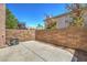 Backyard featuring a concrete patio, brick wall, and clear blue sky at 1605 Colloquium Dr, Henderson, NV 89014