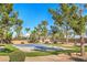 Outdoor basketball court with lush landscaping, ideal for recreation at 1605 Colloquium Dr, Henderson, NV 89014
