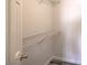 Walk-in closet with a white door and a single wire shelf for organization at 1605 Colloquium Dr, Henderson, NV 89014
