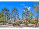 Community clubhouse with lush landscaping and ample parking at 1605 Colloquium Dr, Henderson, NV 89014