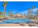 Community pool featuring palm trees, lounge chairs, and a covered cabana at 1605 Colloquium Dr, Henderson, NV 89014
