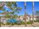 Inviting community pool area with mature landscaping and lounging area at 1605 Colloquium Dr, Henderson, NV 89014