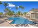 Inviting community pool area with lounge chairs and mature landscaping at 1605 Colloquium Dr, Henderson, NV 89014