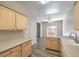 Open concept kitchen featuring laminate countertops and hardwood flooring at 1605 Colloquium Dr, Henderson, NV 89014