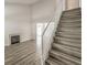 Stairway leading to a living room with fireplace at 1605 Colloquium Dr, Henderson, NV 89014