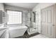 This bathroom features a soaking tub, shower and pebble floor at 1793 Clear River Falls Ln, Henderson, NV 89012