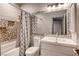 This bathroom features decorative tile accents, shower/tub, toilet, and sink at 1793 Clear River Falls Ln, Henderson, NV 89012