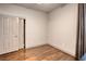 Bedroom featuring hardwood floors, closet space, and neutral paint providing a relaxing atmosphere at 1793 Clear River Falls Ln, Henderson, NV 89012