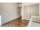 This bedroom features hardwood floors and closet at 1793 Clear River Falls Ln, Henderson, NV 89012