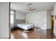 This bedroom features hardwood floors and a ceiling fan at 1793 Clear River Falls Ln, Henderson, NV 89012