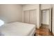 Simple bedroom featuring hardwood floors, closet and neutral paint, providing a blank canvas at 1793 Clear River Falls Ln, Henderson, NV 89012