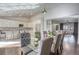 Open floor plan with dining area, modern lighting, and seamless flow to living room and kitchen at 1793 Clear River Falls Ln, Henderson, NV 89012