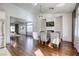 Well-lit dining area with modern furnishings, hardwood floors, and a cozy fireplace at 1793 Clear River Falls Ln, Henderson, NV 89012