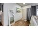 Inviting entryway featuring hardwood floors, a full length mirror, and contemporary decor at 1793 Clear River Falls Ln, Henderson, NV 89012