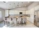 Bright kitchen with large island, breakfast bar, stainless steel appliances, and ample storage at 1793 Clear River Falls Ln, Henderson, NV 89012