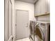 This laundry room features washer and dryer at 1793 Clear River Falls Ln, Henderson, NV 89012