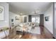 Open living space featuring hardwood floors, modern furnishings, and abundant natural light at 1793 Clear River Falls Ln, Henderson, NV 89012