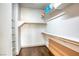 Spacious walk-in closet with multiple shelves, rods and wood floor, providing ample storage at 1793 Clear River Falls Ln, Henderson, NV 89012