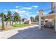 Spacious backyard with putting green, shed, mature trees, and room for outdoor activities at 1808 Quartz Landing Ave, Las Vegas, NV 89183