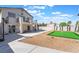 Home featuring a private backyard with a putting green, patio, and ample space for entertaining at 1808 Quartz Landing Ave, Las Vegas, NV 89183