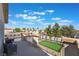 Balcony overlooking the backyard with a putting green and beautiful neighborhood views at 1808 Quartz Landing Ave, Las Vegas, NV 89183