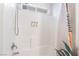 Bright and clean bathroom featuring a shower-tub combo with white subway tiles and a rainfall shower head at 1808 Quartz Landing Ave, Las Vegas, NV 89183