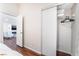 Bedroom view with ample storage inside the closet with built-in shelves and hanging rods at 1808 Quartz Landing Ave, Las Vegas, NV 89183
