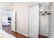 Bedroom view with ample storage inside the closet with built-in shelves and hanging rods at 1808 Quartz Landing Ave, Las Vegas, NV 89183