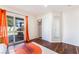Cozy bedroom with hardwood floors, a closet, an outdoor patio, neutral paint, and natural light at 1808 Quartz Landing Ave, Las Vegas, NV 89183