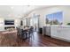 The bright dining area features a vaulted ceiling, a large window, and direct access to the kitchen at 1808 Quartz Landing Ave, Las Vegas, NV 89183