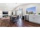 The bright dining area features a vaulted ceiling, a large window, and direct access to the kitchen at 1808 Quartz Landing Ave, Las Vegas, NV 89183