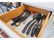 Open kitchen drawer with stainless steel hardware, marble print liner, and array of cooking utensils at 1808 Quartz Landing Ave, Las Vegas, NV 89183