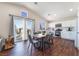Spacious open-concept kitchen featuring stainless steel appliances, modern white cabinets, and natural light at 1808 Quartz Landing Ave, Las Vegas, NV 89183