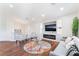 Inviting living room with an electric fireplace, recessed lighting, and hardwood floors at 1808 Quartz Landing Ave, Las Vegas, NV 89183