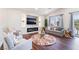 Inviting living room with an electric fireplace, recessed lighting, and hardwood floors at 1808 Quartz Landing Ave, Las Vegas, NV 89183