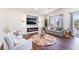 Inviting living room with an electric fireplace, recessed lighting, and hardwood floors at 1808 Quartz Landing Ave, Las Vegas, NV 89183