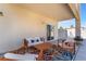 Cozy covered patio featuring stylish outdoor furniture, a ceiling fan, and a barbecue grill at 1808 Quartz Landing Ave, Las Vegas, NV 89183