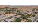 Neighborhood aerial view with multiple homes, desert landscape, and lake in the distance at 1981 Trophy Elk Ave, Logandale, NV 89021