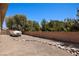 Boat parking, gravel landscaping, and a block wall offer privacy in the backyard at 1981 Trophy Elk Ave, Logandale, NV 89021