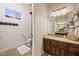 Bathroom with tile floors, granite vanity, and a mirror reflecting ample counter space at 1981 Trophy Elk Ave, Logandale, NV 89021
