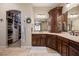 Bathroom featuring stylish cabinetry, granite countertops, and entry to walk-in closet at 1981 Trophy Elk Ave, Logandale, NV 89021