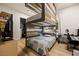 Stylish bedroom with a custom-built bunk bed and a walk-in closet at 1981 Trophy Elk Ave, Logandale, NV 89021