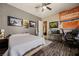 This bedroom features neutral walls, a ceiling fan, and desk workspace at 1981 Trophy Elk Ave, Logandale, NV 89021