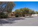Home exterior with mature trees on a tree lined street at 1981 Trophy Elk Ave, Logandale, NV 89021
